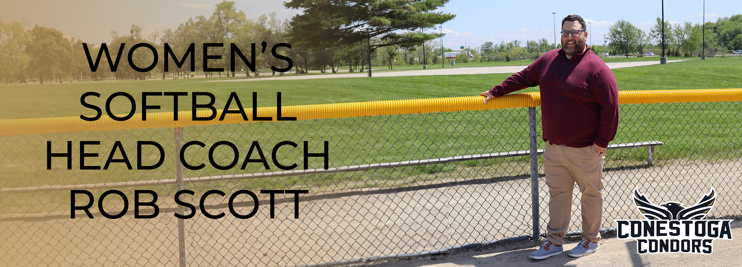 Head Coach of Softball Rob Scott stands in from of a fence on a softball diamond. The headline reads Women's Softball Head Coach Rob Scott.
