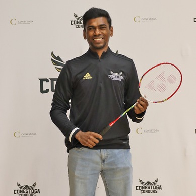 A photo of Valliappan Padmanabhan holding a badminton racquet. 