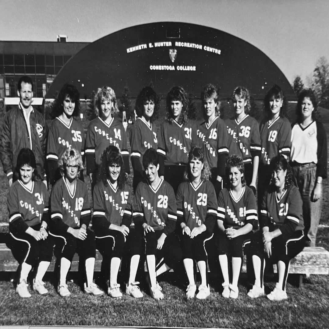 A black and white photo of the 1989 women's softball team. 