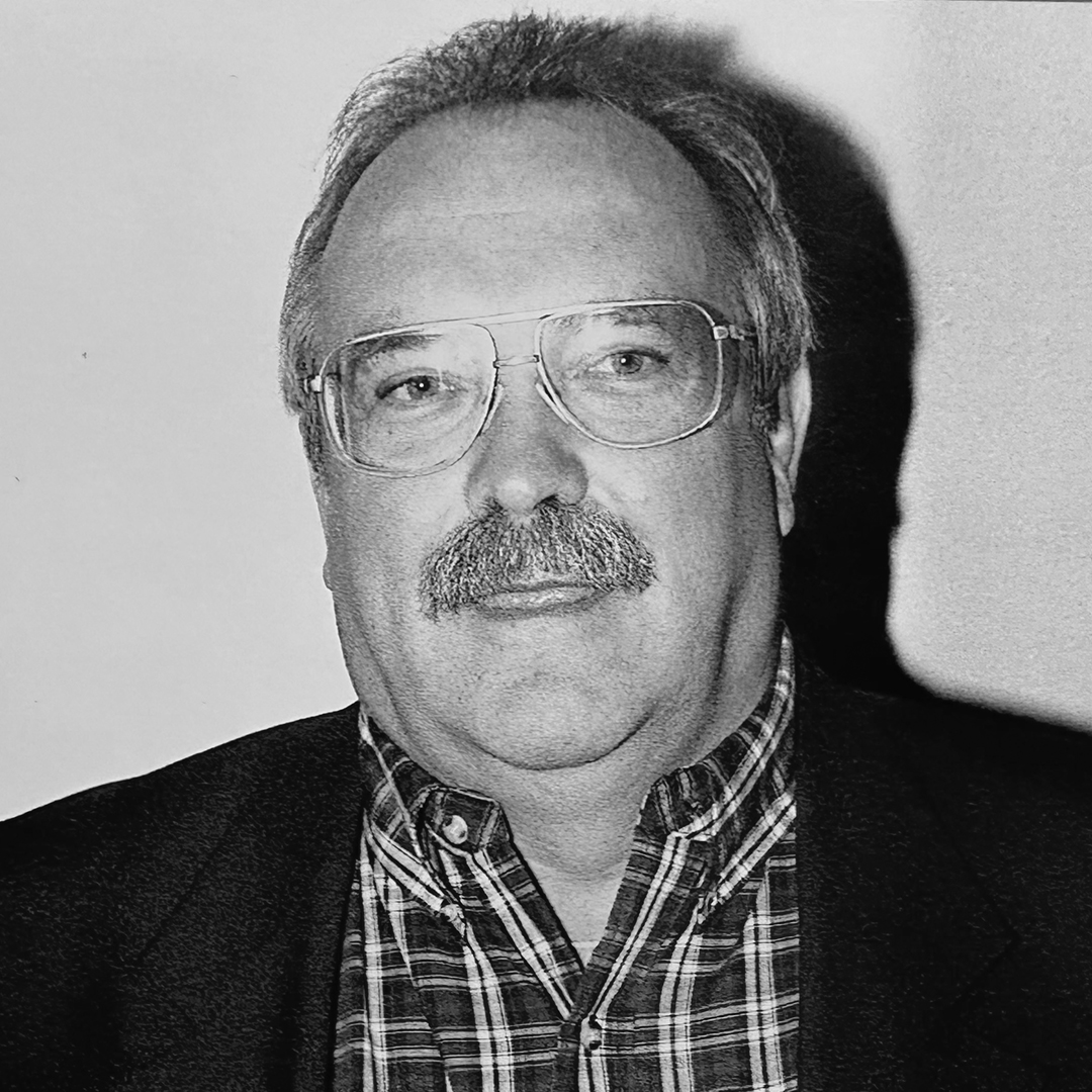 A black and white headshot of Dan Young. 