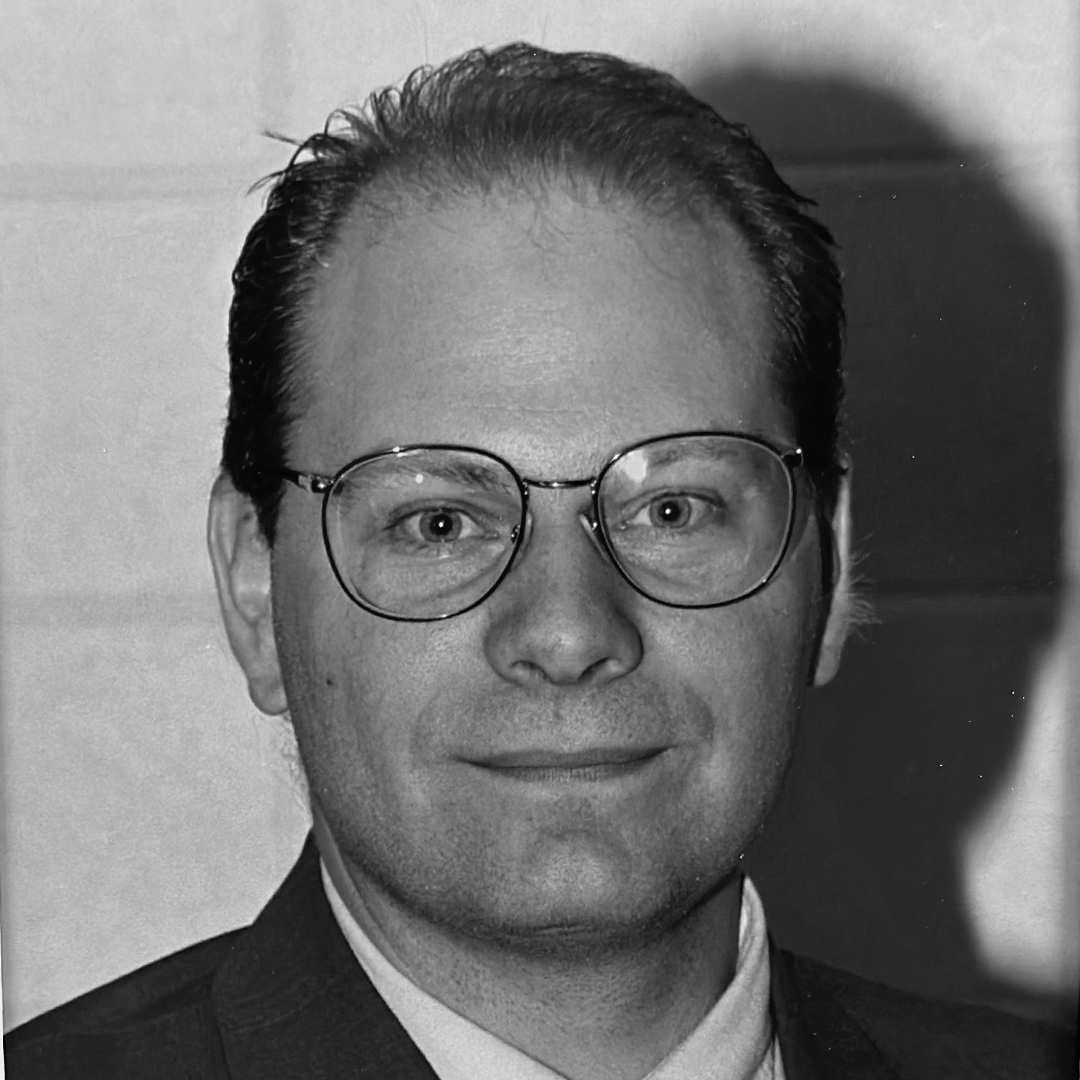 A black and white headshot of Giulio Mior. 