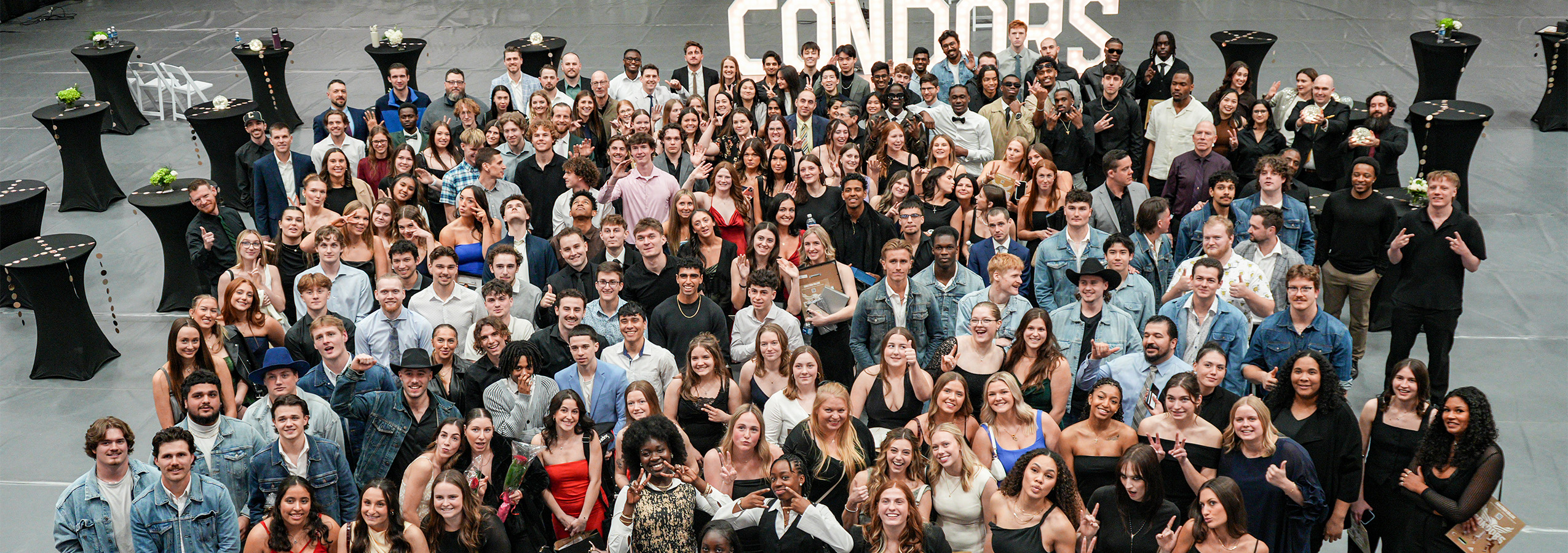 A large group photo of all of the Conestoga Condors varsity athletes at the 57th annual varsity banquet. 